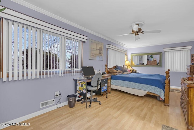 bedroom featuring ceiling fan, ornamental molding, and light hardwood / wood-style floors