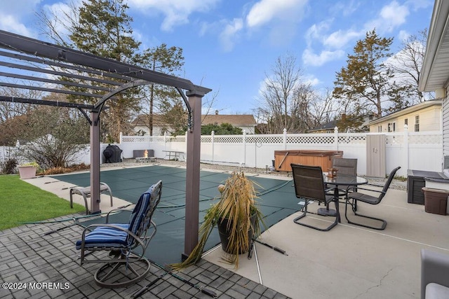 view of patio with a hot tub and a pergola