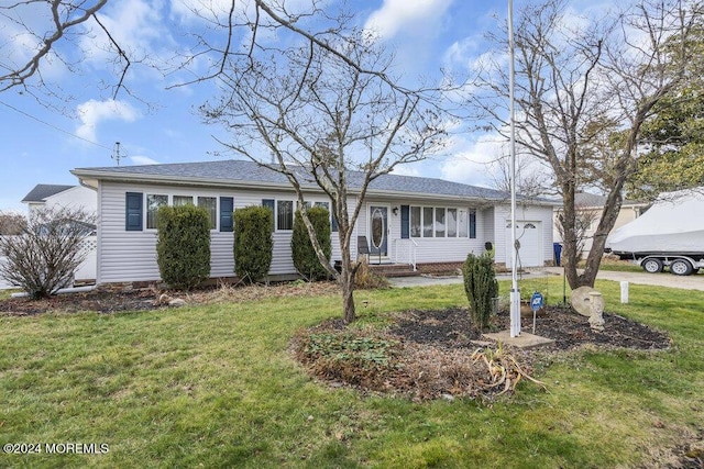 ranch-style home featuring a front yard