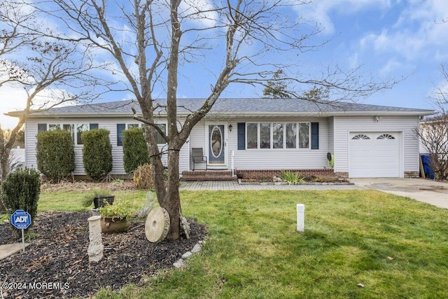 single story home with a front yard and a garage