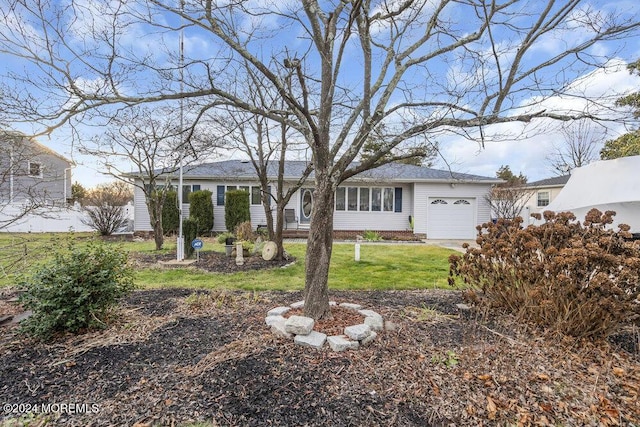 exterior space featuring a garage and a front yard