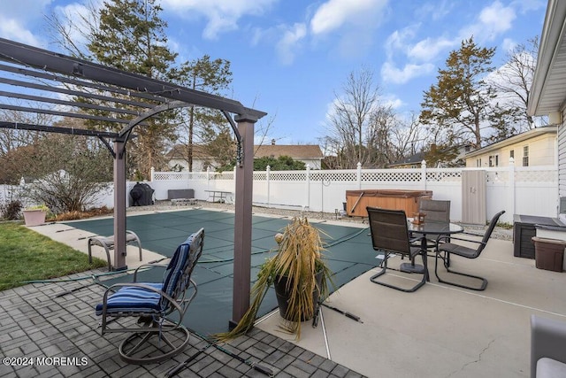 view of patio / terrace with a pergola and a hot tub