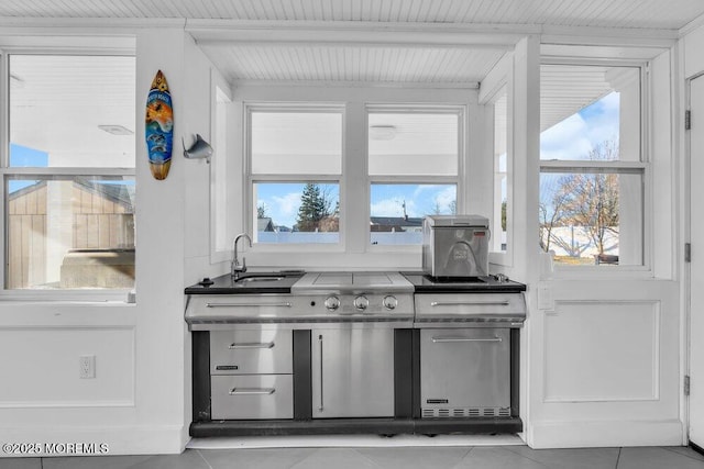 kitchen featuring sink and light tile patterned floors