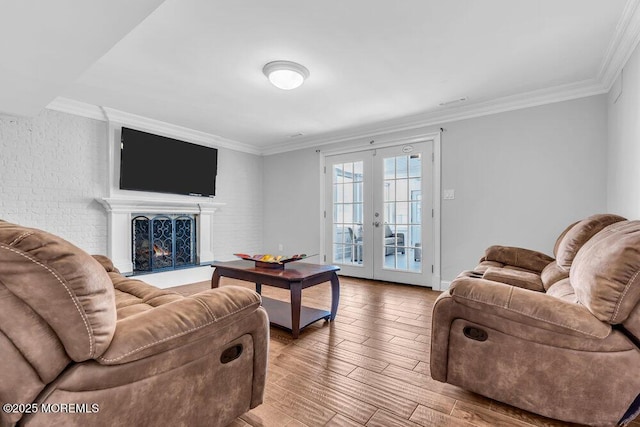 living room featuring crown molding and french doors