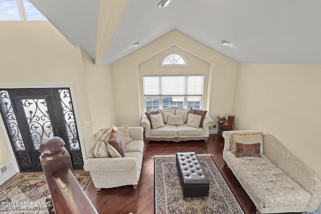 living room with vaulted ceiling and dark hardwood / wood-style floors