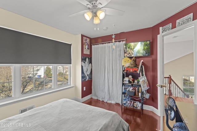 bedroom featuring wood-type flooring and ceiling fan