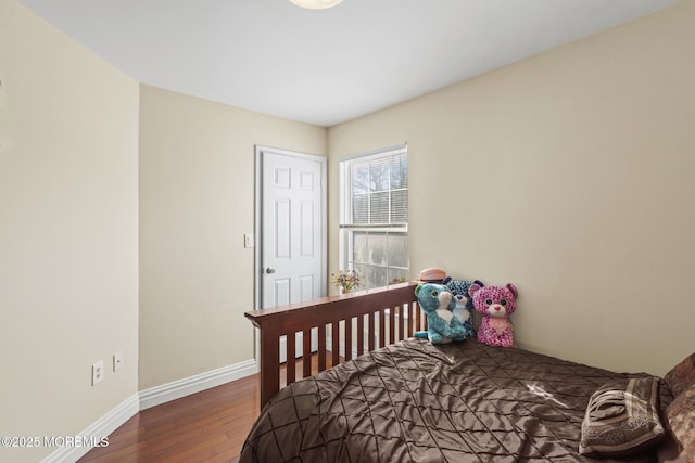 bedroom featuring dark wood-type flooring