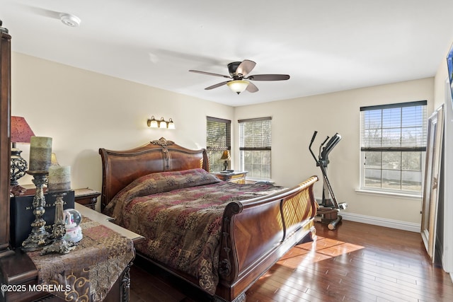 bedroom with dark wood-type flooring and ceiling fan