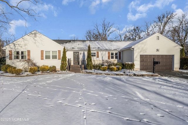 single story home featuring a garage