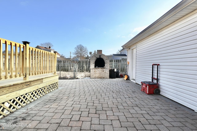 view of patio / terrace featuring a fireplace and a deck