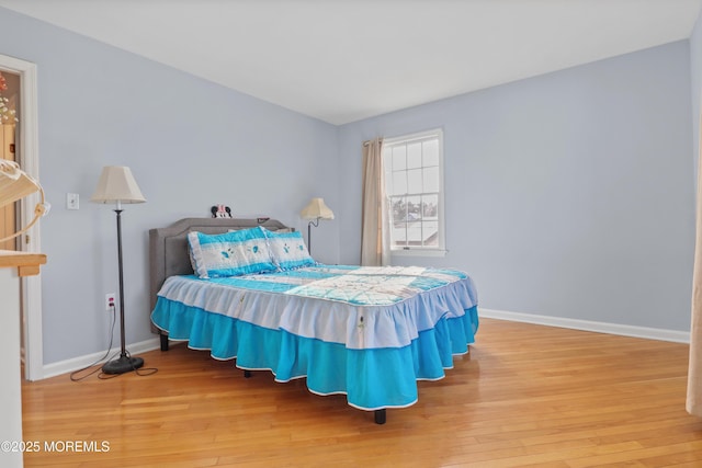 bedroom with wood-type flooring