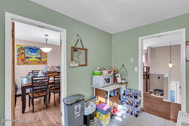 game room with light hardwood / wood-style floors