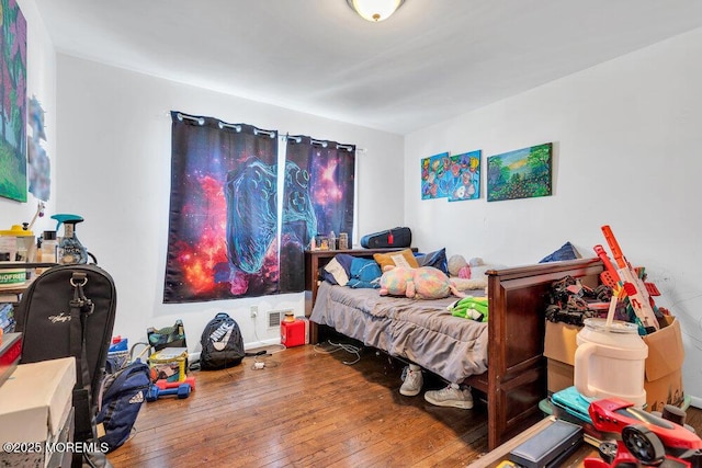 bedroom featuring hardwood / wood-style floors