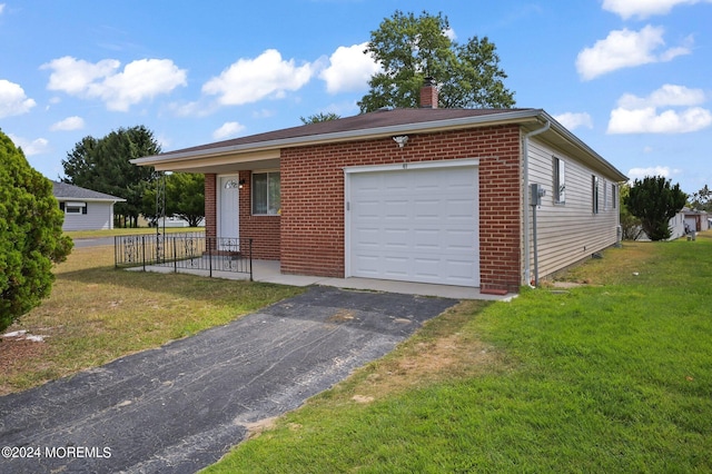 garage featuring a lawn