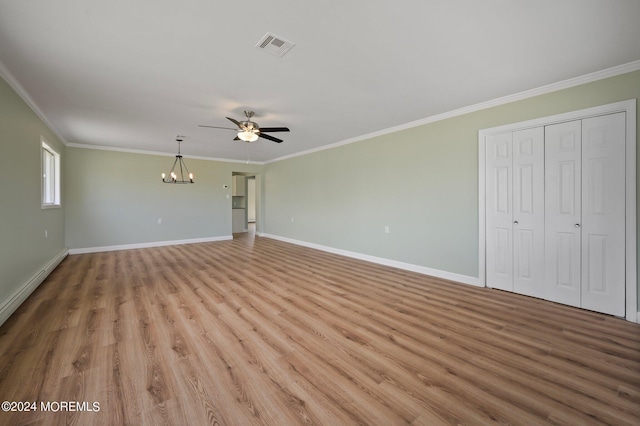 unfurnished living room with baseboard heating, light wood-type flooring, crown molding, and ceiling fan with notable chandelier