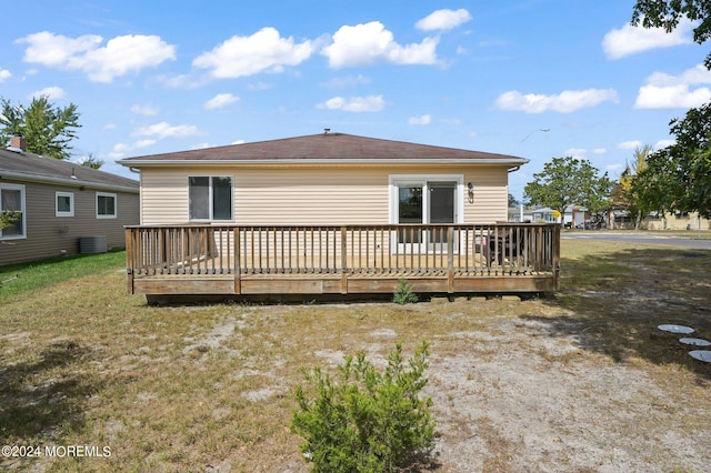 back of property featuring central AC and a wooden deck