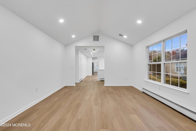 unfurnished living room featuring light hardwood / wood-style flooring, a baseboard radiator, and lofted ceiling