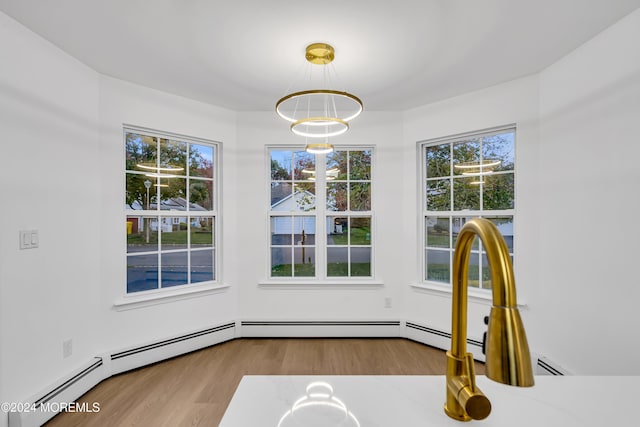 unfurnished dining area with light hardwood / wood-style flooring