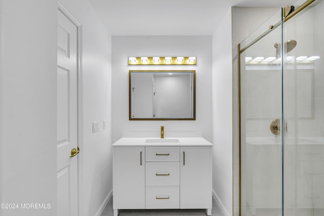 bathroom featuring walk in shower and vanity