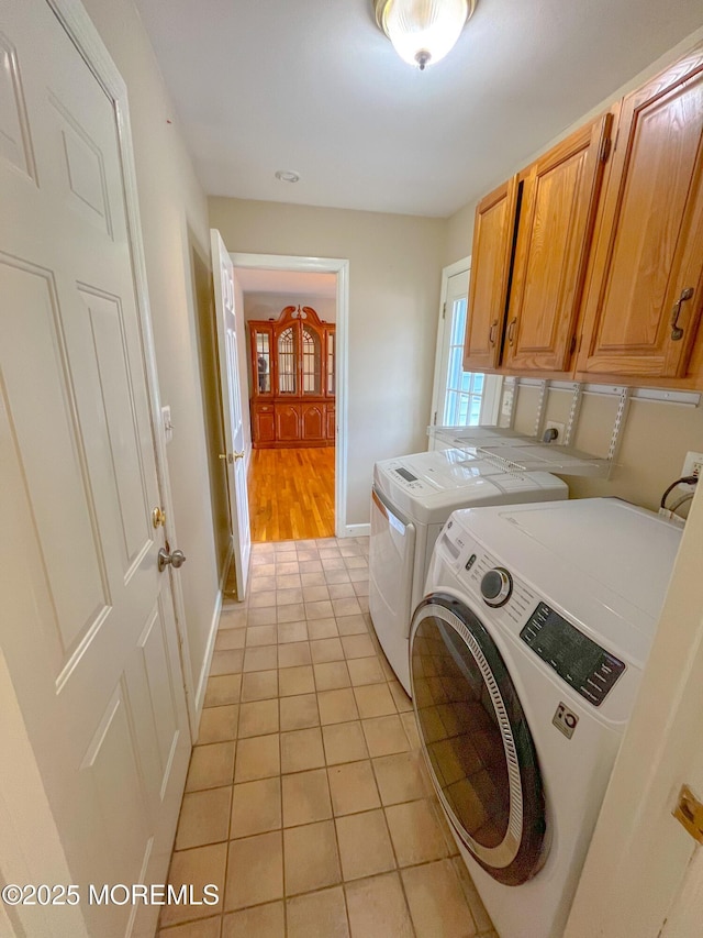 169 Docare Rd, Jackson, NJ 08527 - laundry area with separate washer and dryer, cabinet space, light tile patterned floors, and baseboards