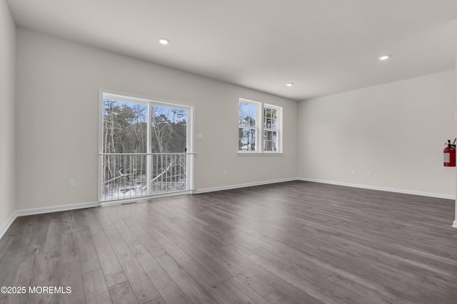 spare room featuring dark hardwood / wood-style flooring