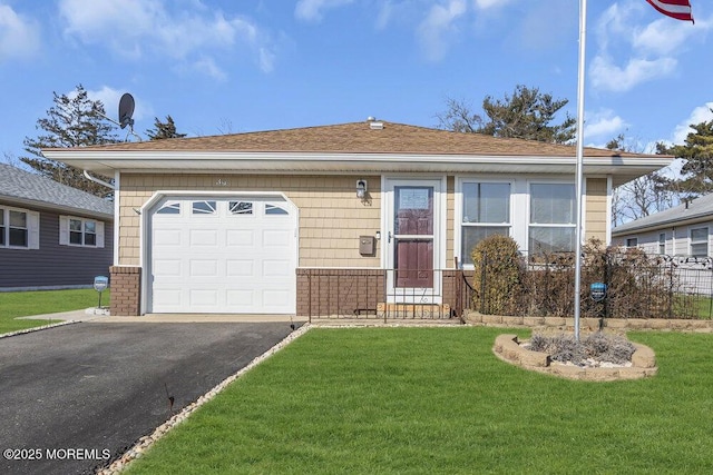 view of front of home featuring a garage and a front lawn