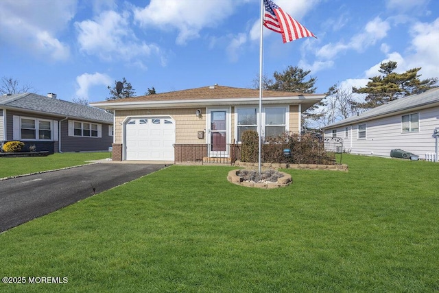 single story home with a garage and a front yard