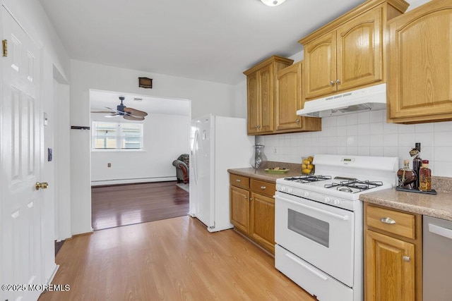 kitchen featuring tasteful backsplash, a baseboard radiator, ceiling fan, white appliances, and light hardwood / wood-style flooring