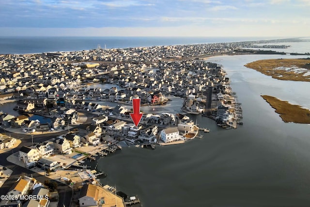 drone / aerial view with a water view