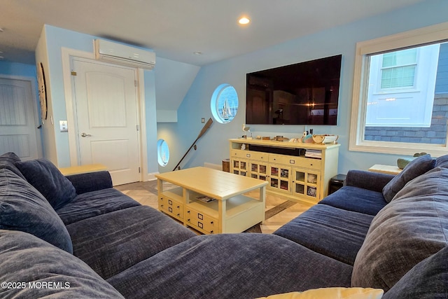 living room with lofted ceiling and a wall mounted AC