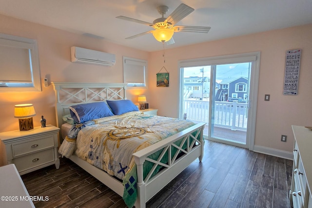 bedroom featuring an AC wall unit, dark hardwood / wood-style flooring, access to outside, and ceiling fan