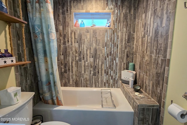 bathroom with toilet and shower / tub combo