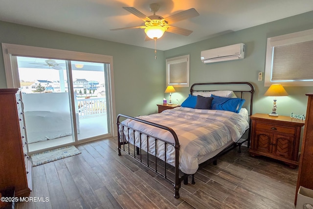 bedroom with ceiling fan, access to exterior, a wall unit AC, and dark wood-type flooring