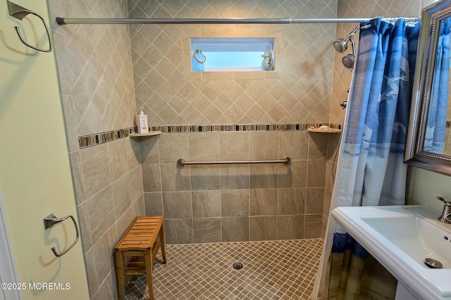 bathroom featuring walk in shower and sink