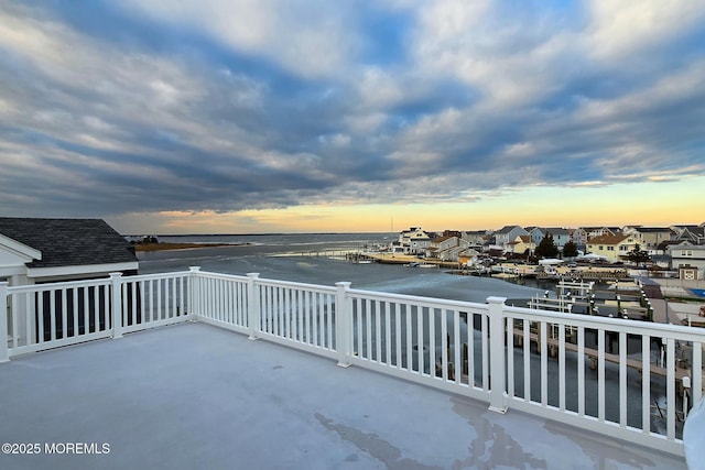 patio terrace at dusk with a water view