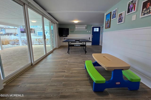 playroom with a wall mounted air conditioner