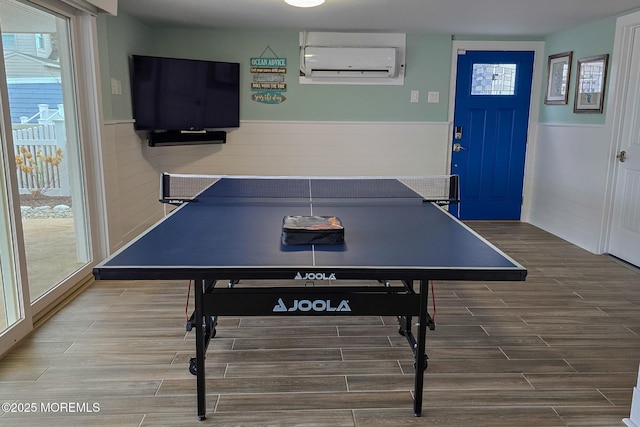 game room featuring a wall unit AC