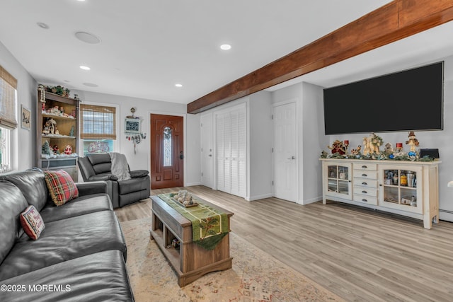 living room with beam ceiling and light hardwood / wood-style floors