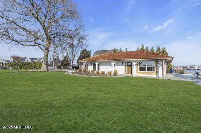 exterior space with a garage and a front lawn