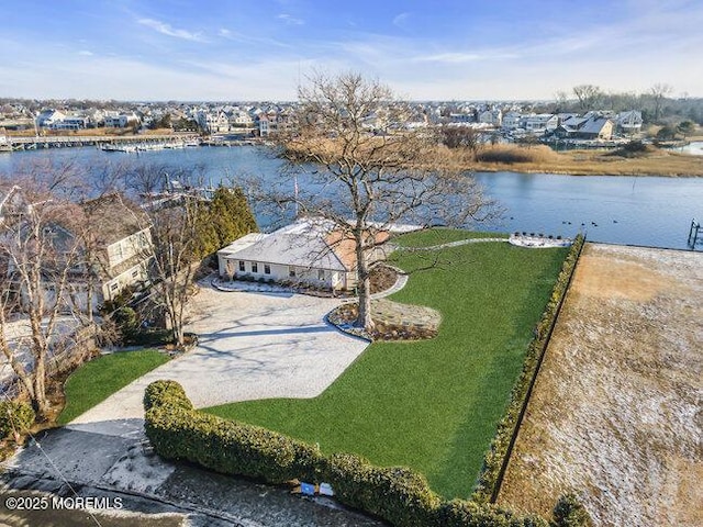 drone / aerial view with a water view