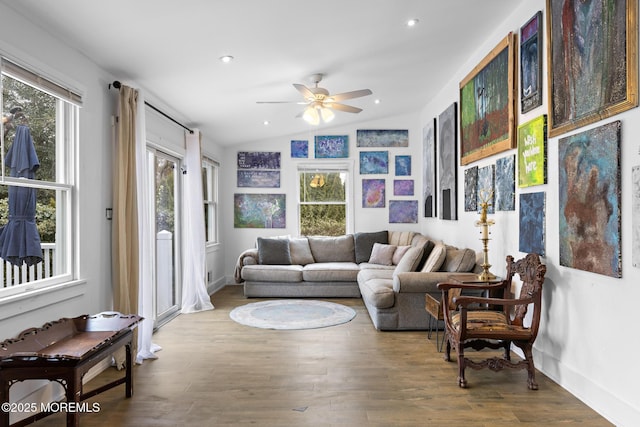 living room featuring lofted ceiling, ceiling fan, and hardwood / wood-style floors