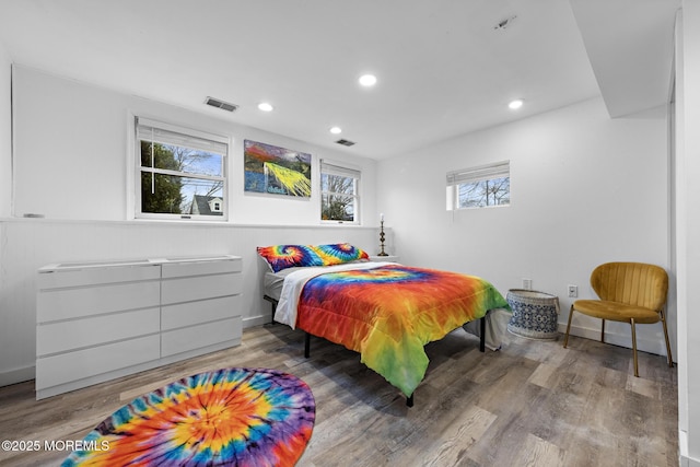 bedroom with hardwood / wood-style floors