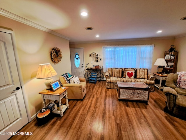 living room featuring ornamental molding and hardwood / wood-style floors