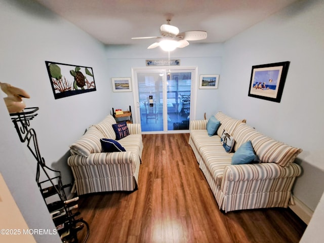 living room with ceiling fan and hardwood / wood-style floors