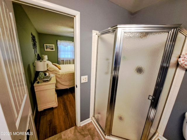 bathroom featuring wood-type flooring and walk in shower