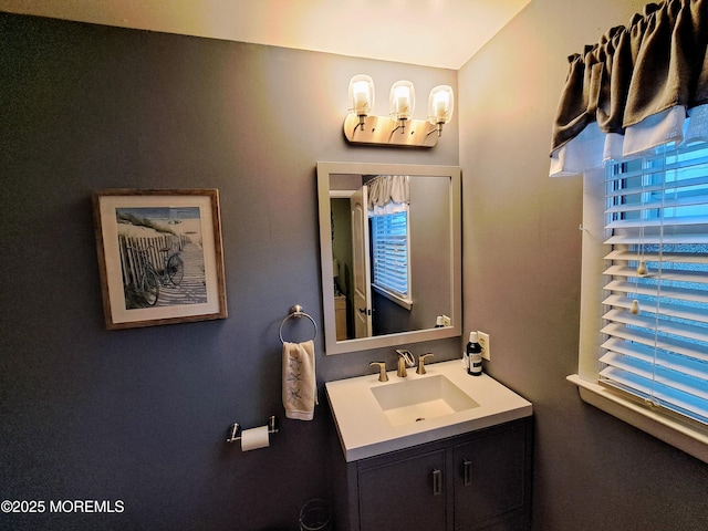 bathroom with a wealth of natural light and vanity