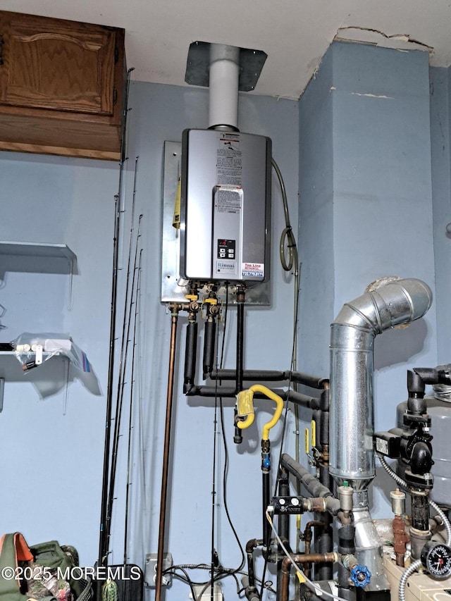 utility room featuring water heater