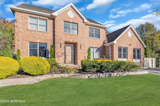 view of front property with a front lawn