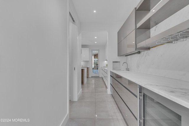 interior space featuring wine cooler and sink