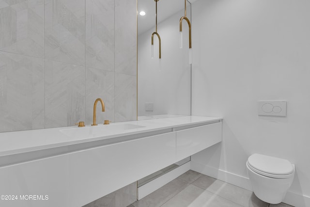 bathroom with vanity, tile patterned floors, and toilet